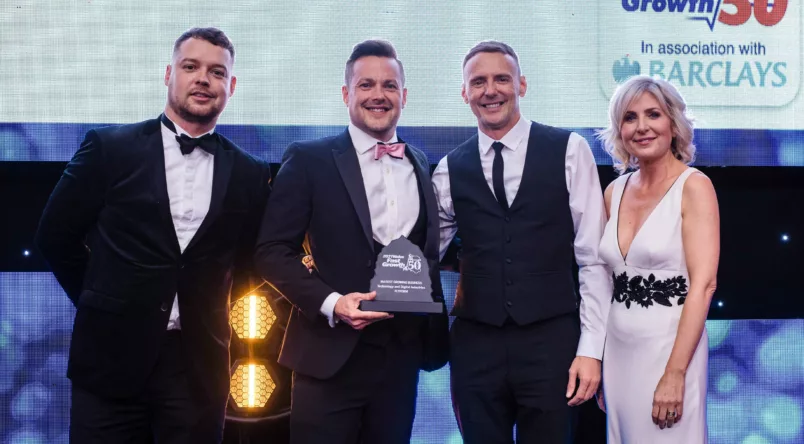 FlyForm CEO Philip Davies and COO Arron Davies accept the award for Fastest Growing Technology and Digital Business at the 2021 Fast Growth 50 Awards ceremony