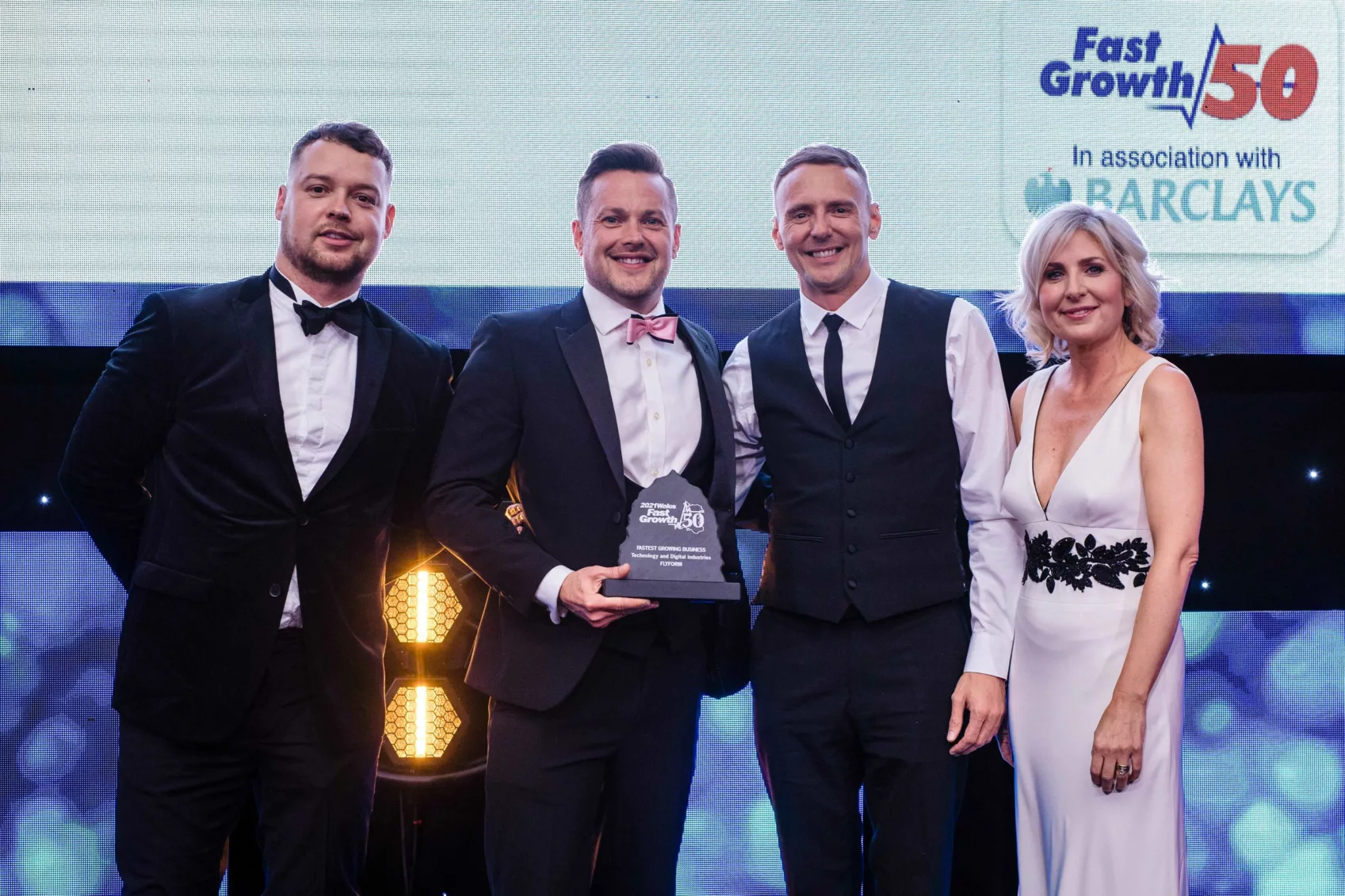 FlyForm CEO Philip Davies and COO Arron Davies accept the award for Fastest Growing Technology and Digital Business at the 2021 Fast Growth 50 Awards ceremony